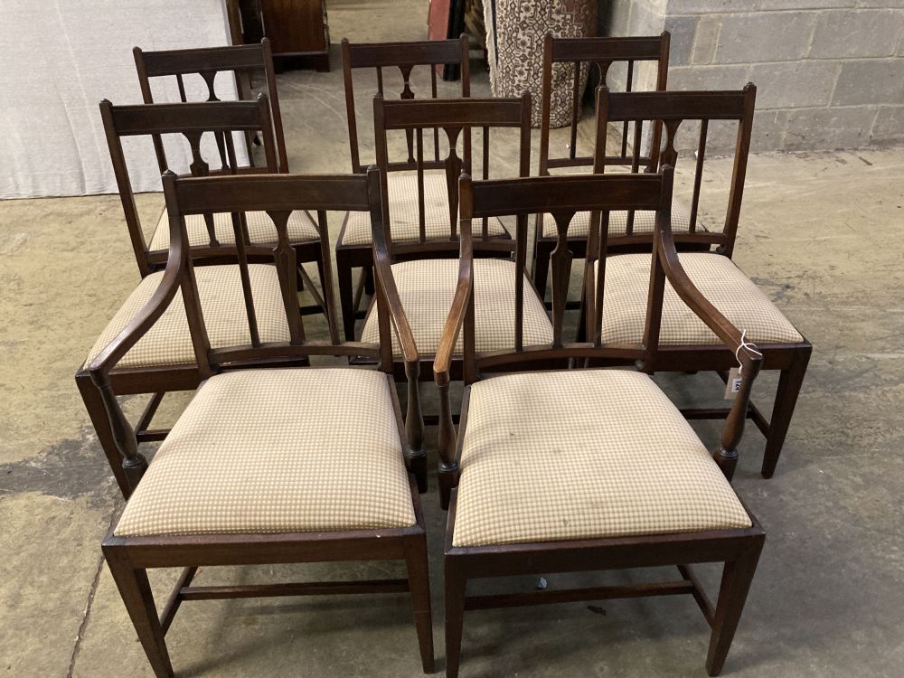 A set of eight late George III mahogany dining chairs, two with arms, six single